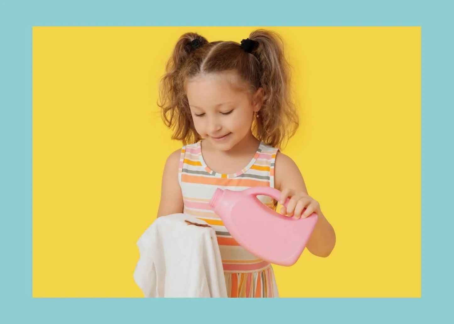 A little girl in pigtails plays with a small pink bowl in the Ohio Floral burp cloth and bib combo.