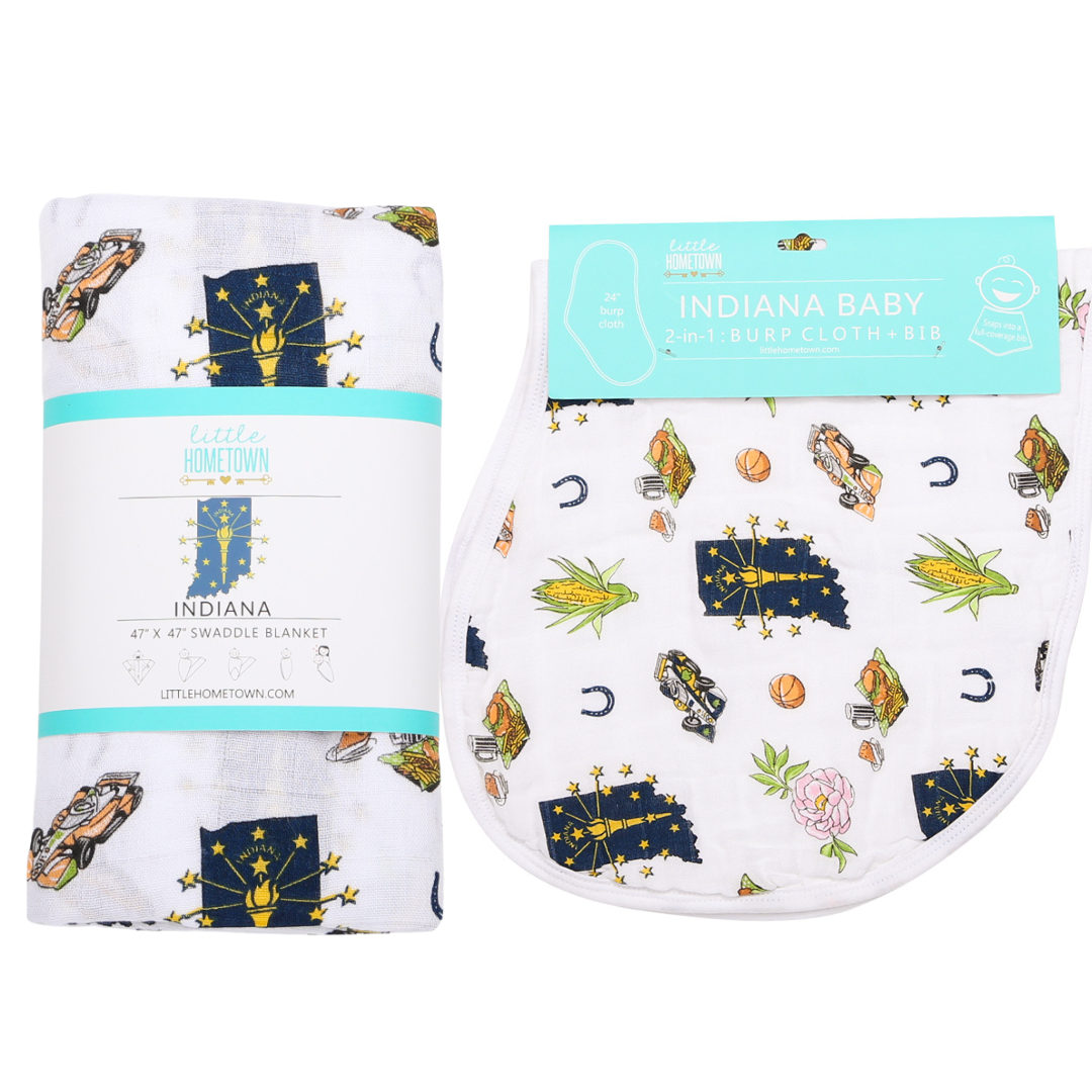 The Indiana gift set shown with its rolled swaddle and coordinating burp cloth and bib combo.
