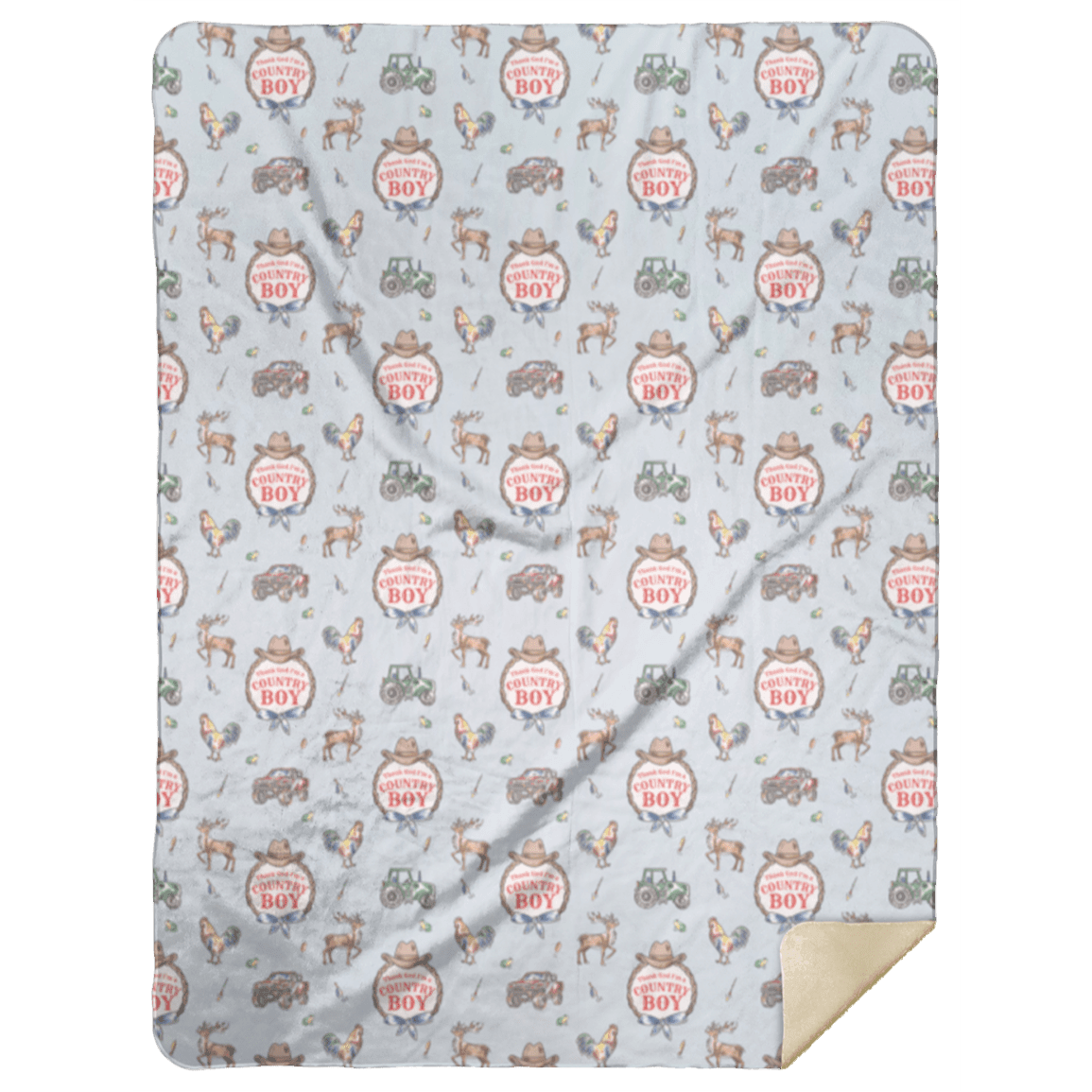 The grey Country Boy plush throw blanket printed with cowboy badges, one cream corner folded back.