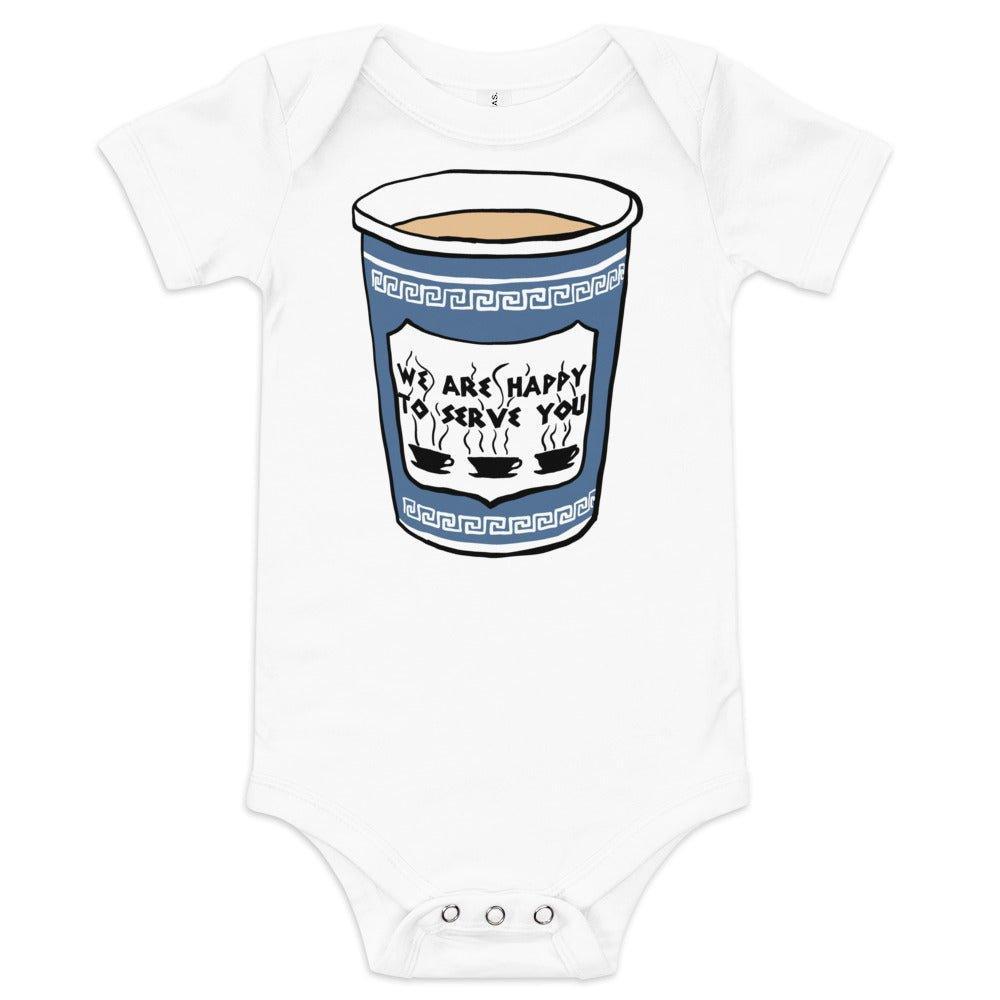 The Astoria baby onesie from New York, laid flat with the classic blue and white coffee cup on it.