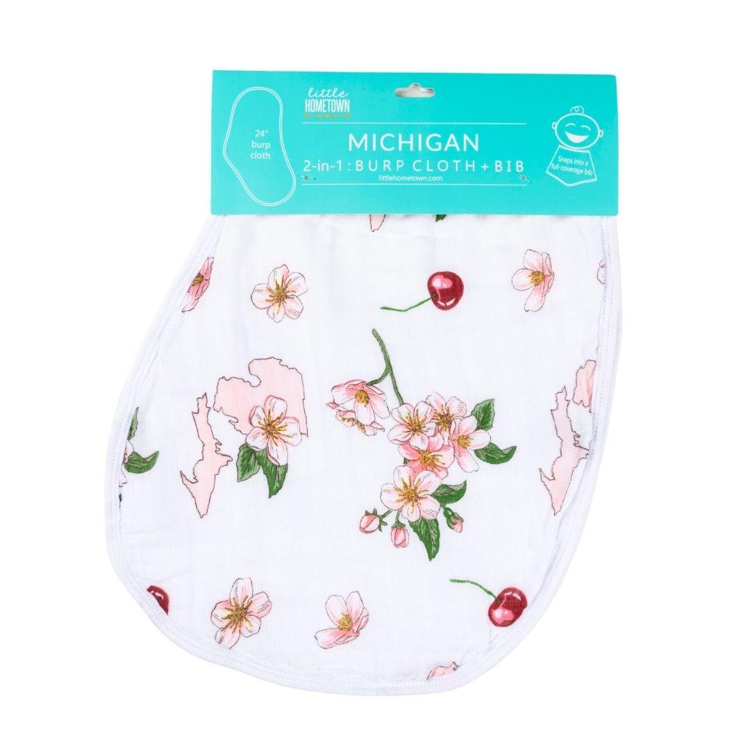 The Michigan floral burp cloth and bib combo, packaged with apple blossoms and ripe summer cherries.