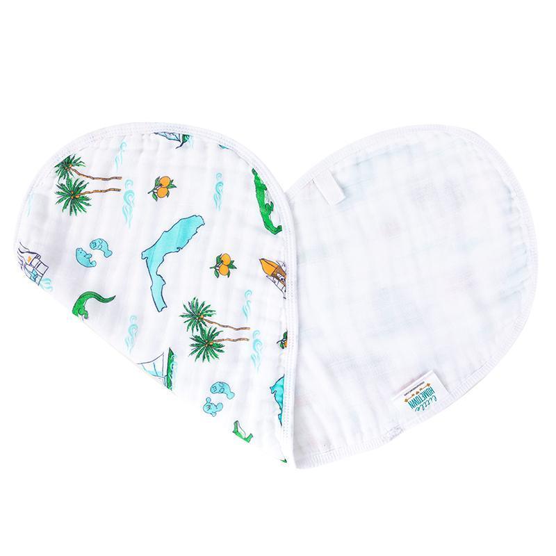 Baby burp cloth and wraparound bib set with Florida-themed illustrations, including oranges and palm trees.