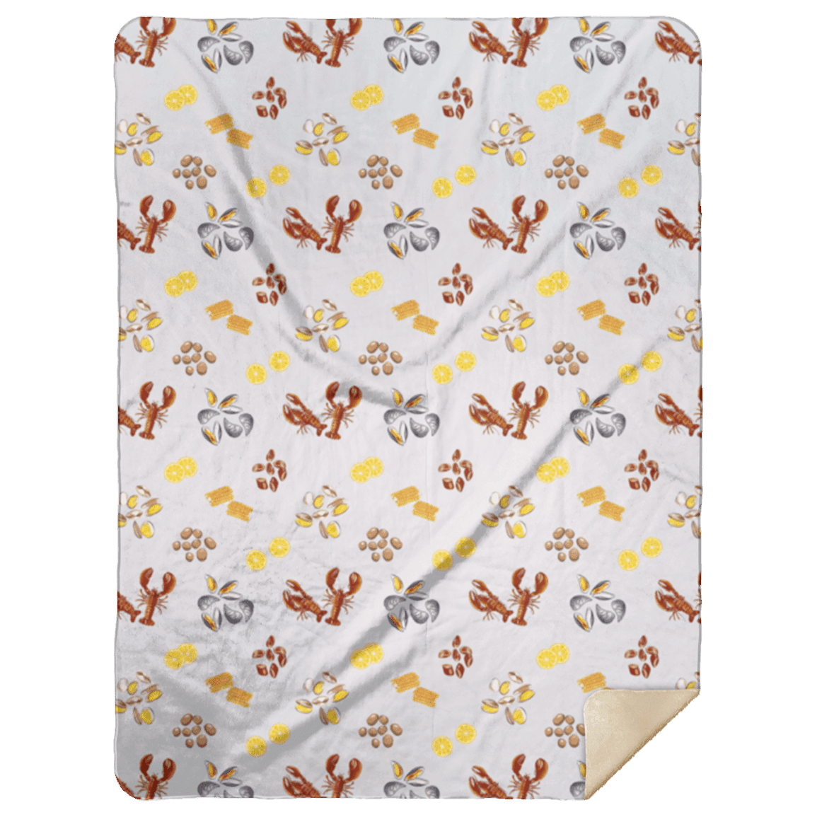 The Clam Bake plush throw blanket covered in lobsters and summer favorites, one corner folded softly back.