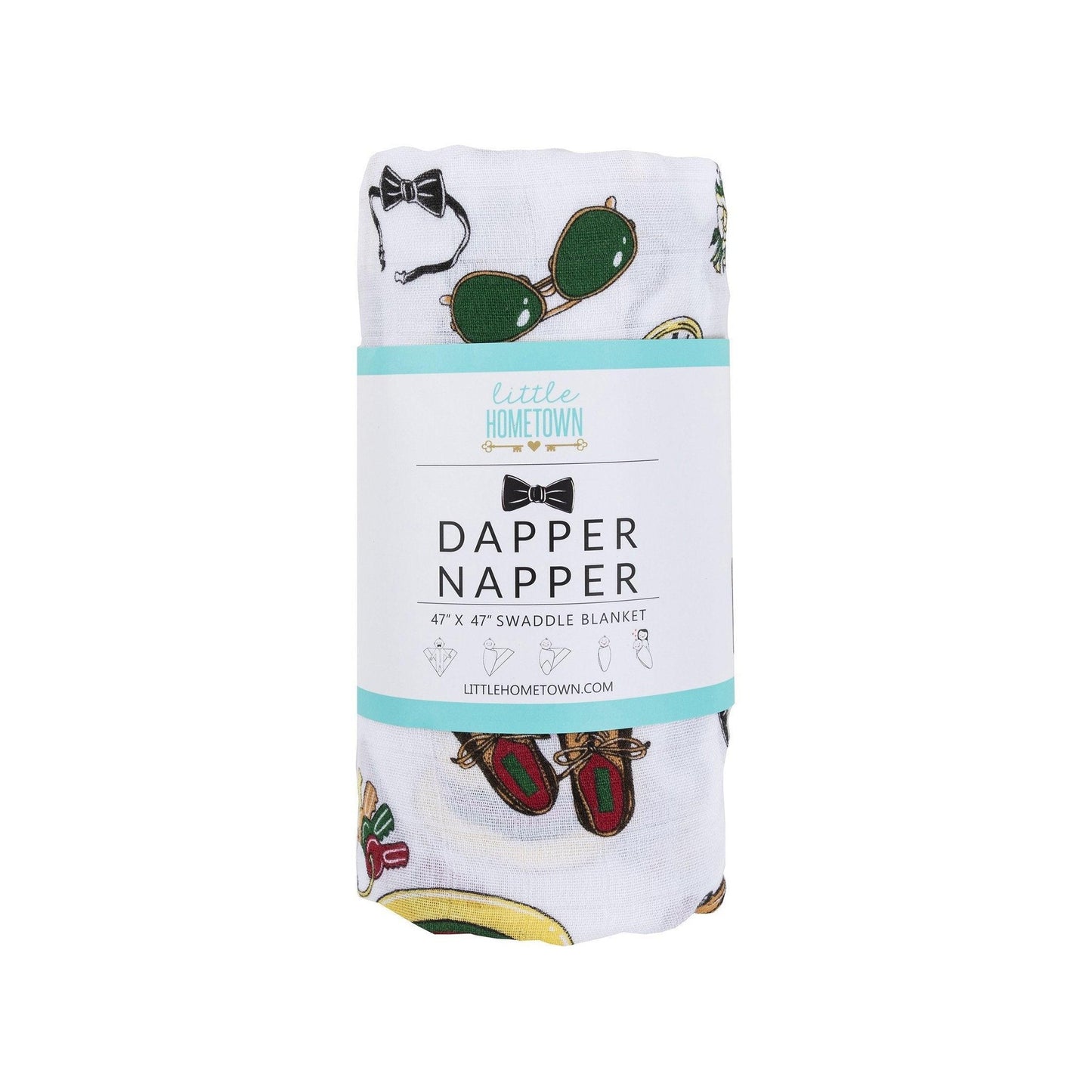 The Dapper Napper muslin swaddle blanket rolled in its branded band, bow ties and loafers showing.