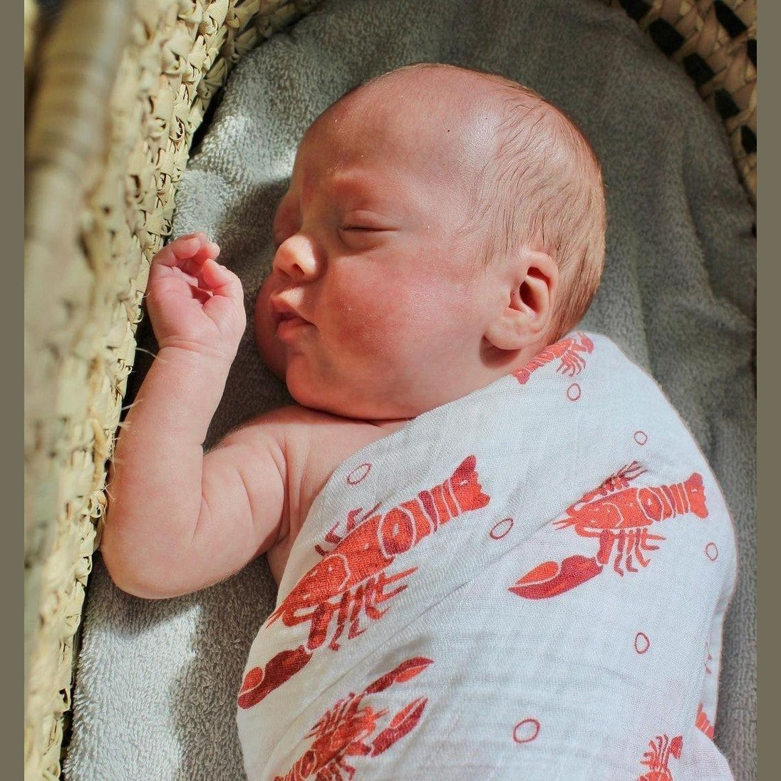 Gift set with crawfish and lobster-themed baby muslin swaddle blanket and burp cloth/bib combo.