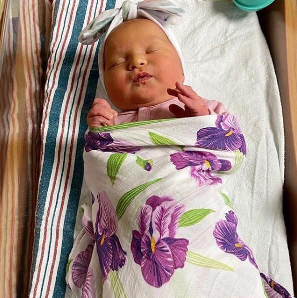 Gift set with a baby muslin swaddle blanket and burp cloth/bib combo featuring a delicate irises pattern.