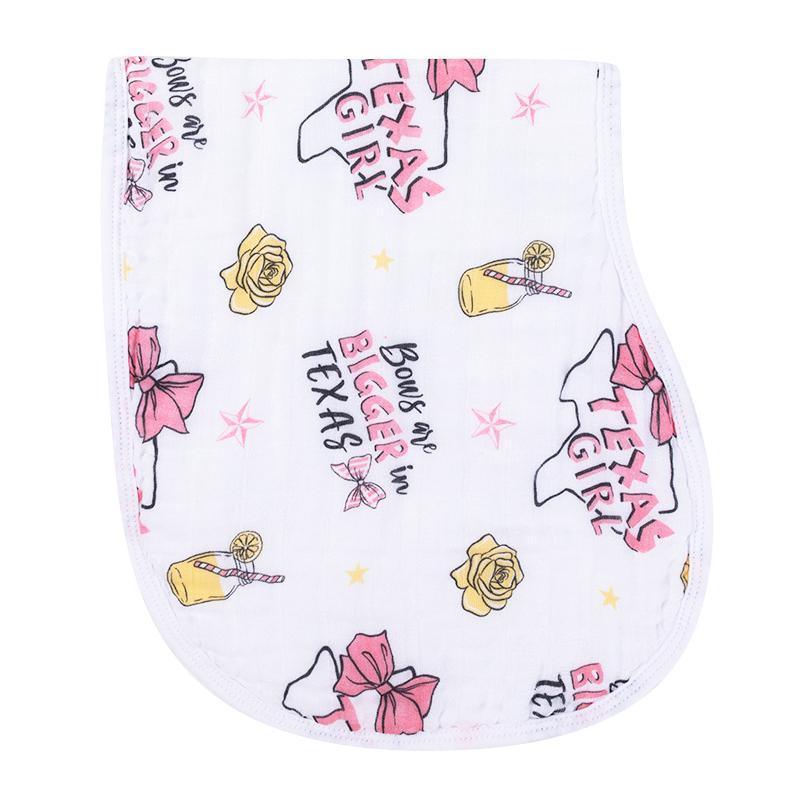 Texas-themed baby girl gift set with a muslin swaddle blanket and burp cloth/bib combo, featuring pink and white designs.