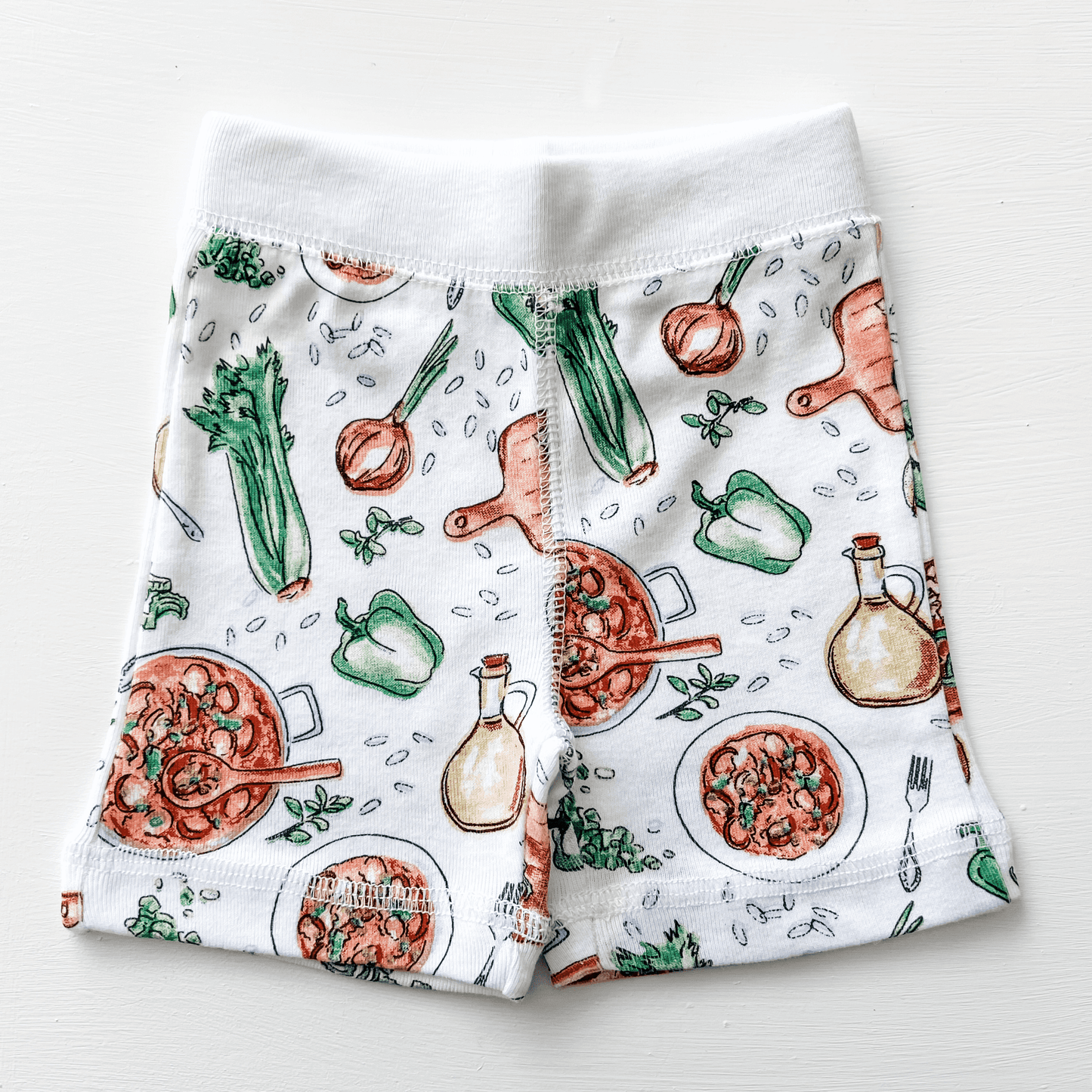 The Louisiana Jambalaya baby pajamas shorts shown flat with their soft elastic waist on white.