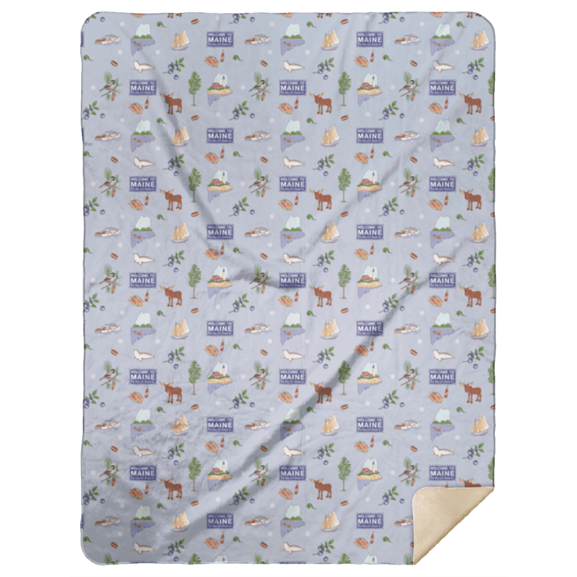 The Maine plush throw blanket folded on a green backdrop, printed with lighthouses and moose.