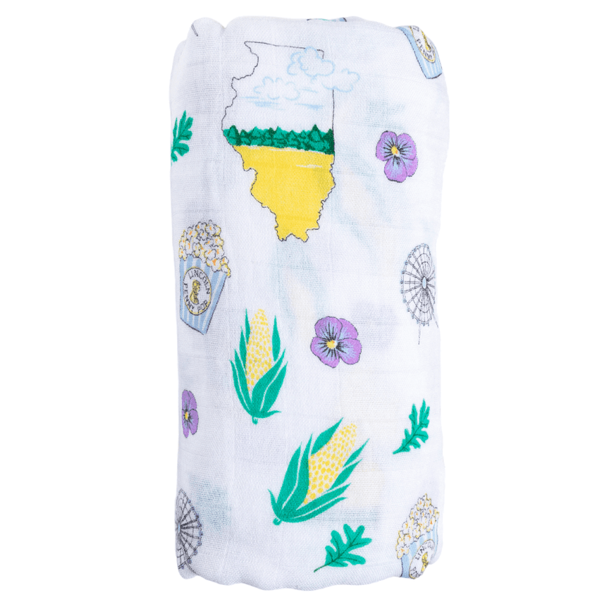 The Illinois muslin swaddle blanket, rolled into a soft bundle against a clean white background.
