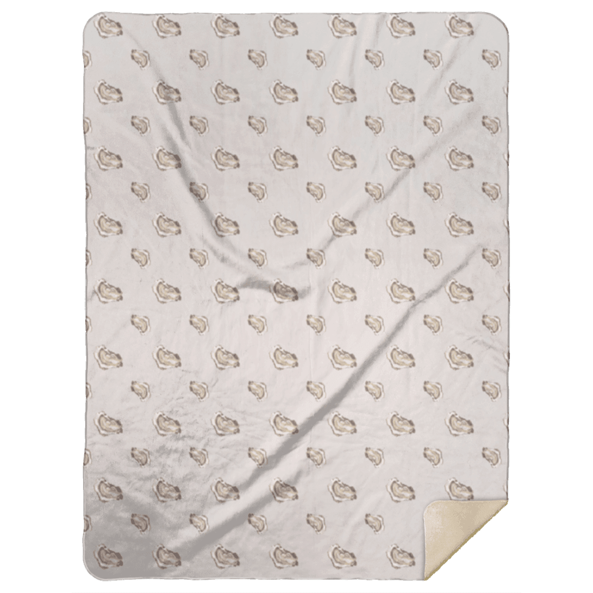 The Oyster plush throw blanket in soft neutral tones, folded back to show its cream colored backing.