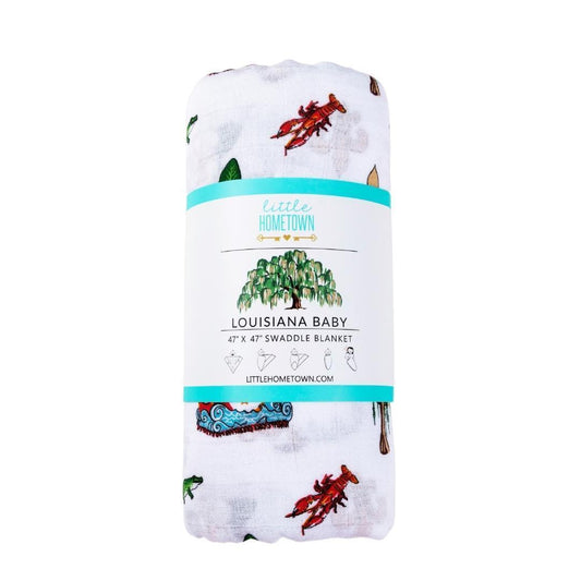 Louisiana baby muslin swaddle printed with crawfish, gumbo, magnolias and a Mardi Gras float