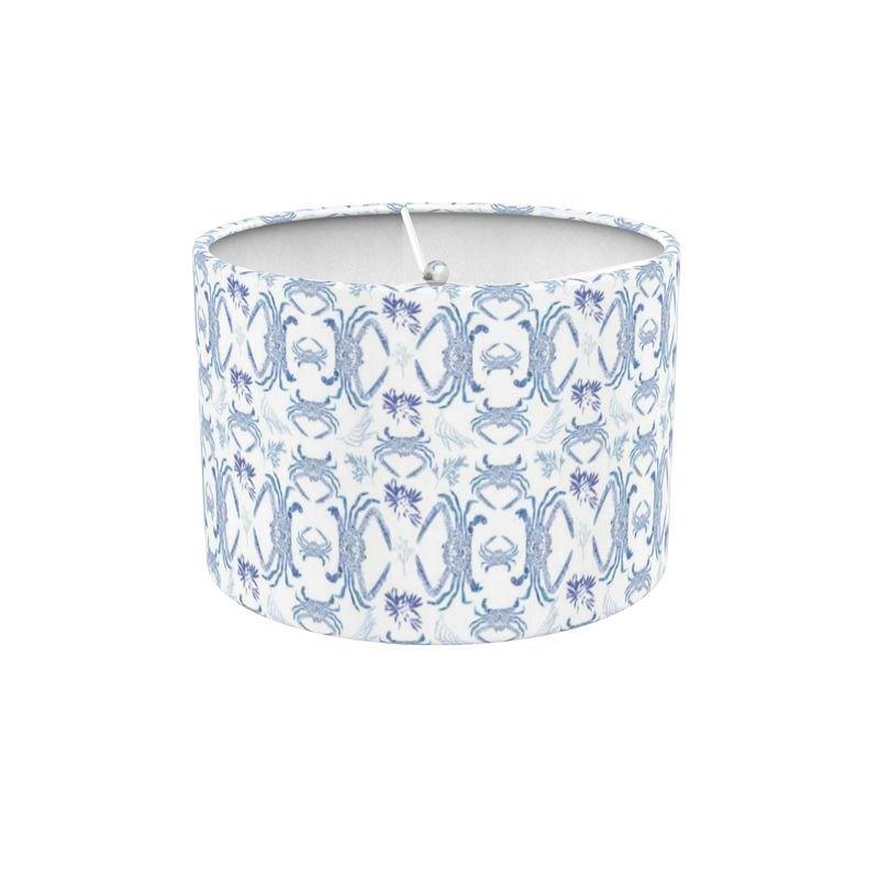 Blue crab illustration on a white lampshade, featuring intricate details and vibrant blue hues.