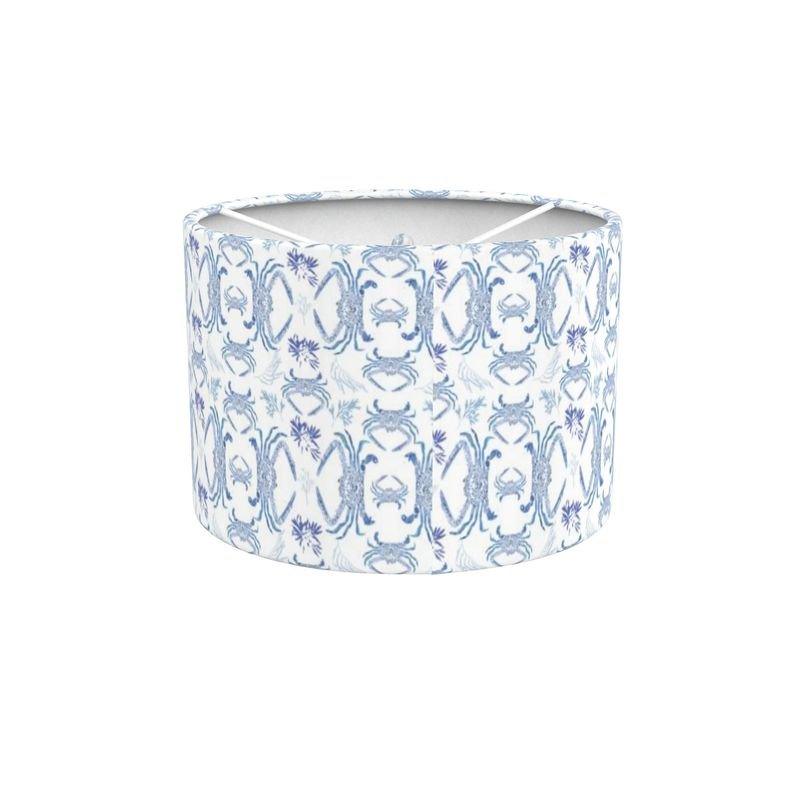 Blue crab illustration on a white lampshade, featuring intricate details and vibrant blue hues.