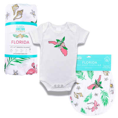 The Florida Orange Blossom Bundle with a rolled muslin swaddle blanket, flamingo onesie and bib set.