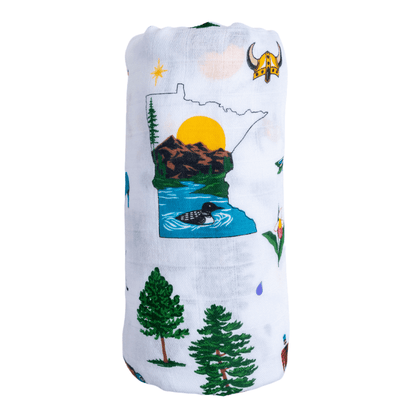 Minnesota-themed baby muslin swaddle blanket featuring an outline of the map with a loon swimming during sunrise