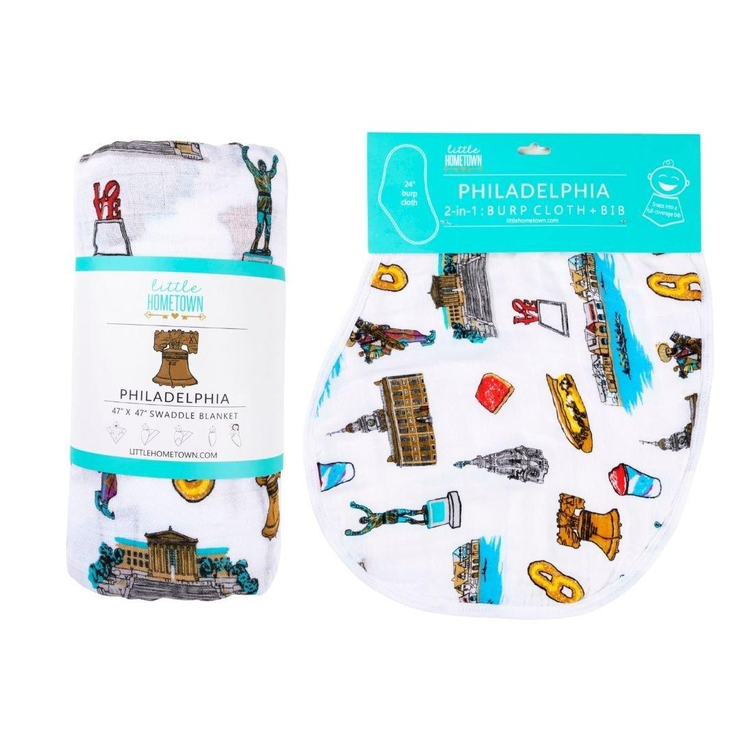 Cozy Philadelphia-themed blanket and bib set featuring iconic state symbols and landmarks in vibrant colors.