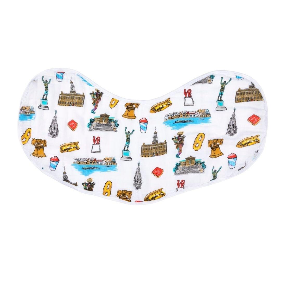 Close up of design elements on Philadelphia-themed baby bib featuring iconic state symbols and landmarks in vibrant colors including Love statue, Rocky, Tomato Pie, water ice, cheesesteak and a mummer