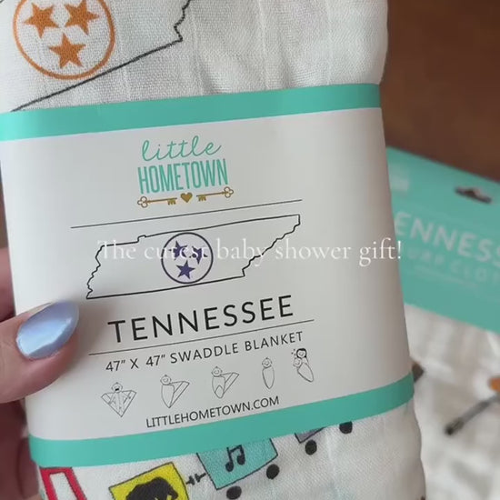 Tennessee Baby Gift Set swaddle and burp cloth bib with a newborn