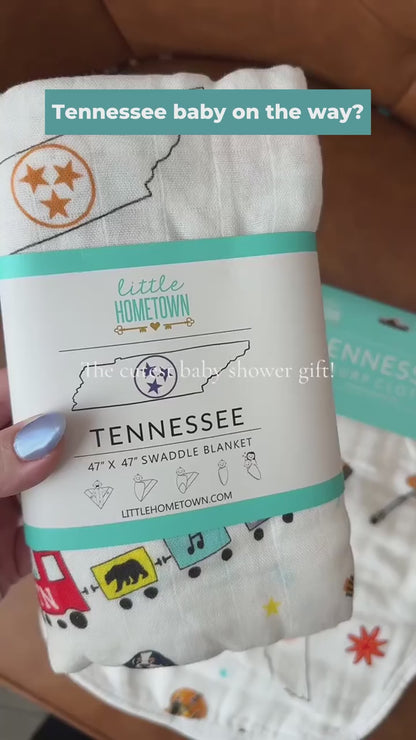 Tennessee Baby Gift Set swaddle and burp cloth bib with a newborn