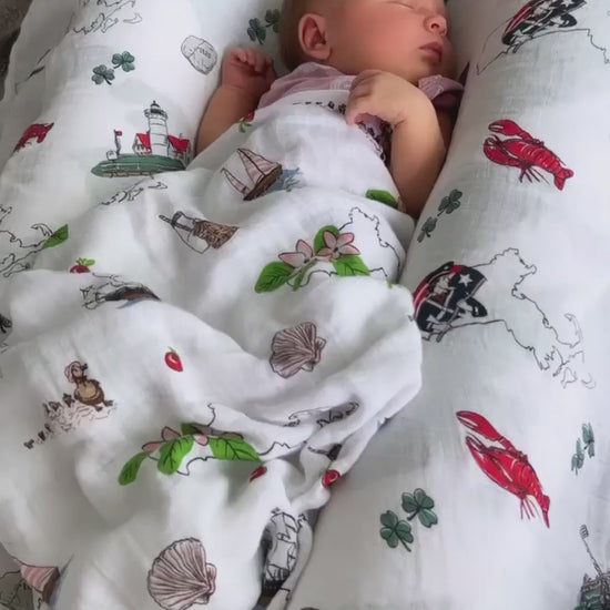 Newborn sleeping in the Massachusetts Floral swaddle