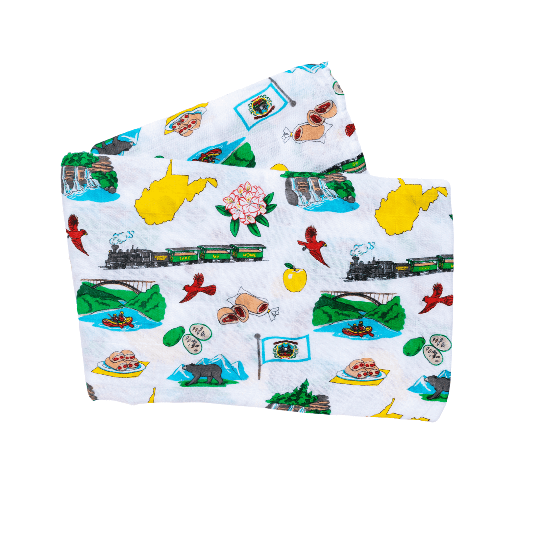 White muslin swaddle blanket with a West Virginia map print, featuring landmarks, animals, and state symbols.