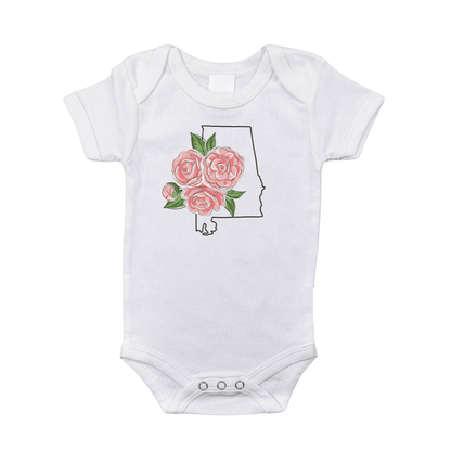 White baby onesie with "Alabama" and a red camellia flower graphic, by Little Hometown, on a plain background.