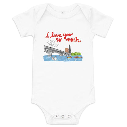 White baby onesie with "Austin, I love you so much" in red text over a citiscape of the Austin bridge ducks, and kayakers, displayed on a plain background.