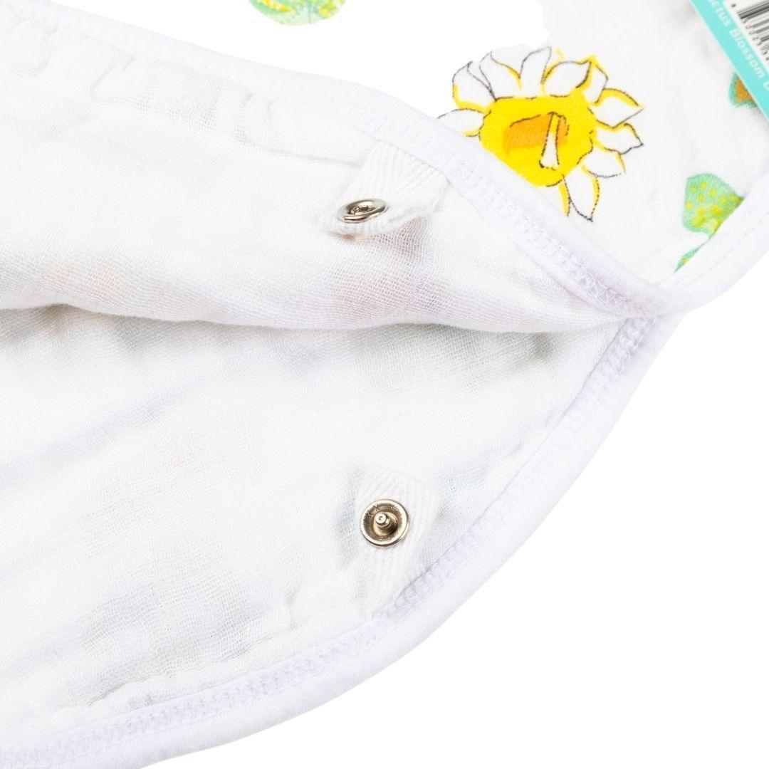 Baby bib and burp cloth set with colorful cactus blossom design on a white background, by Little Hometown.
