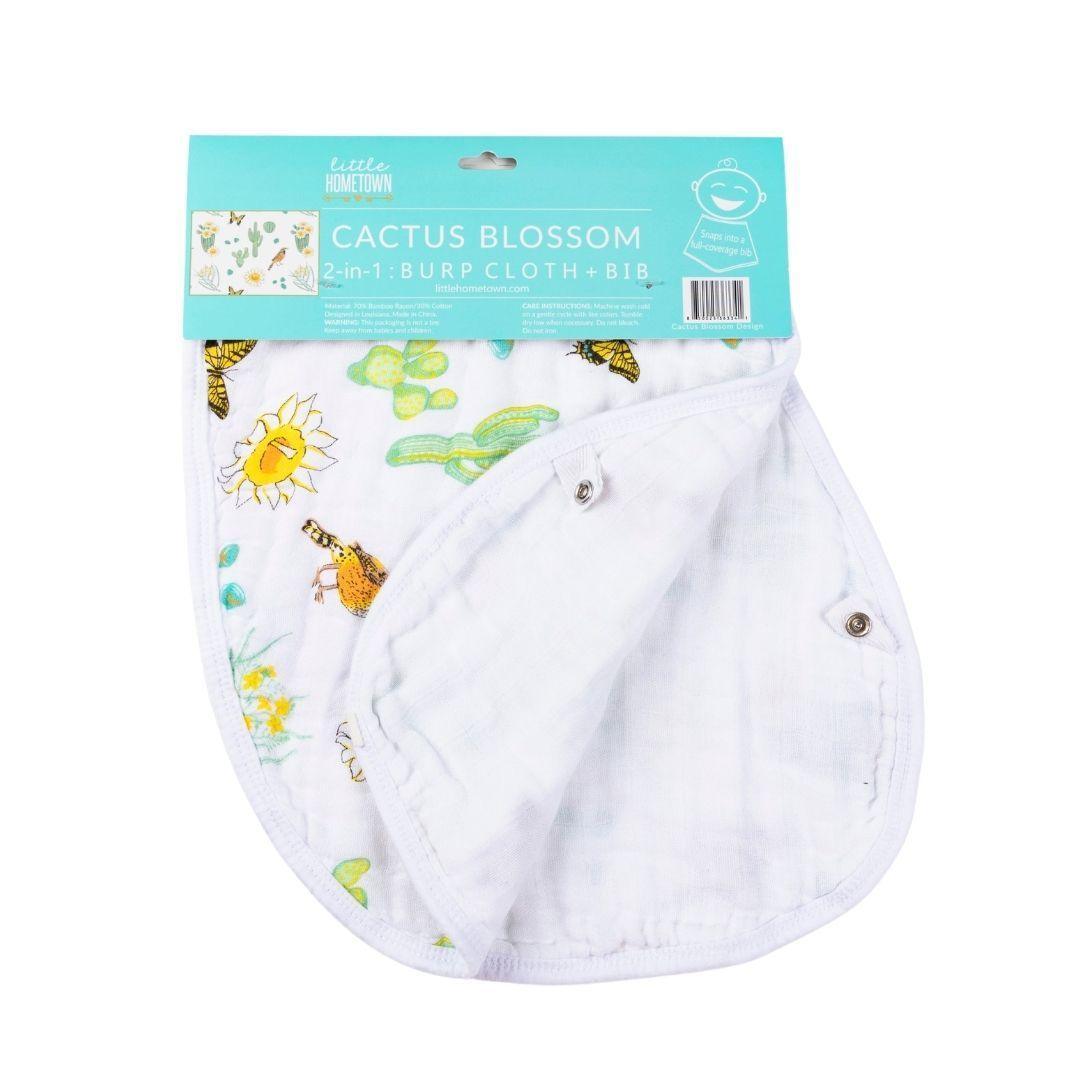 Baby bib and burp cloth set with colorful cactus blossom pattern on a white background.