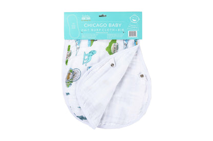 White baby bib and burp cloth set featuring a colorful Chicago skyline and landmarks illustration.