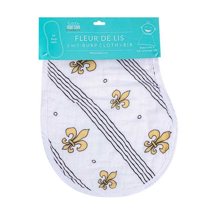 Baby bib and burp cloth set with blue fleur-de-lis pattern on white fabric, displayed on a wooden surface.
