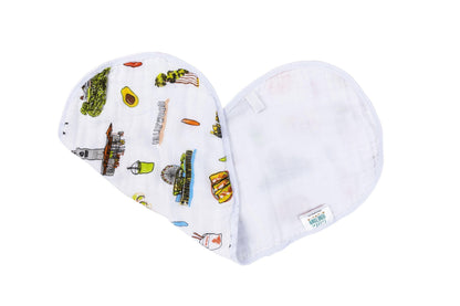 Baby bib and burp cloth set with "Los Angeles Baby" text, featuring colorful city icons on a white background.