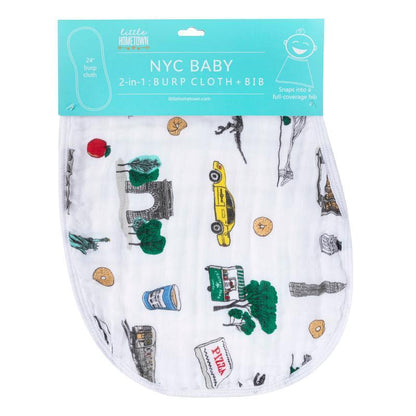 White baby bib and burp cloth set featuring colorful New York City icons like taxis, skyscrapers, and the Statue of Liberty.