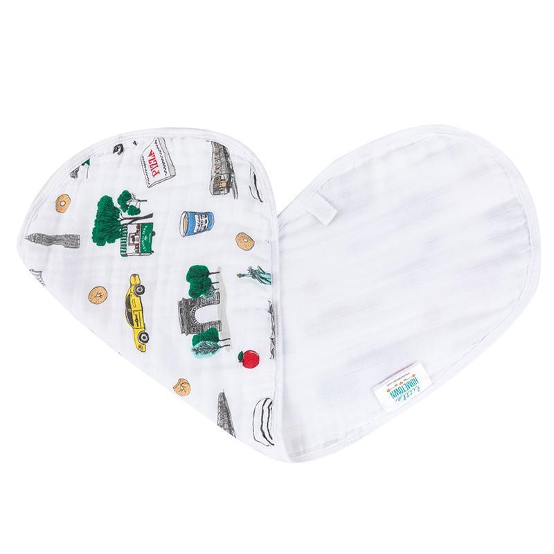White baby bib and burp cloth set featuring colorful New York City icons like taxis, skyscrapers, and the Statue of Liberty.