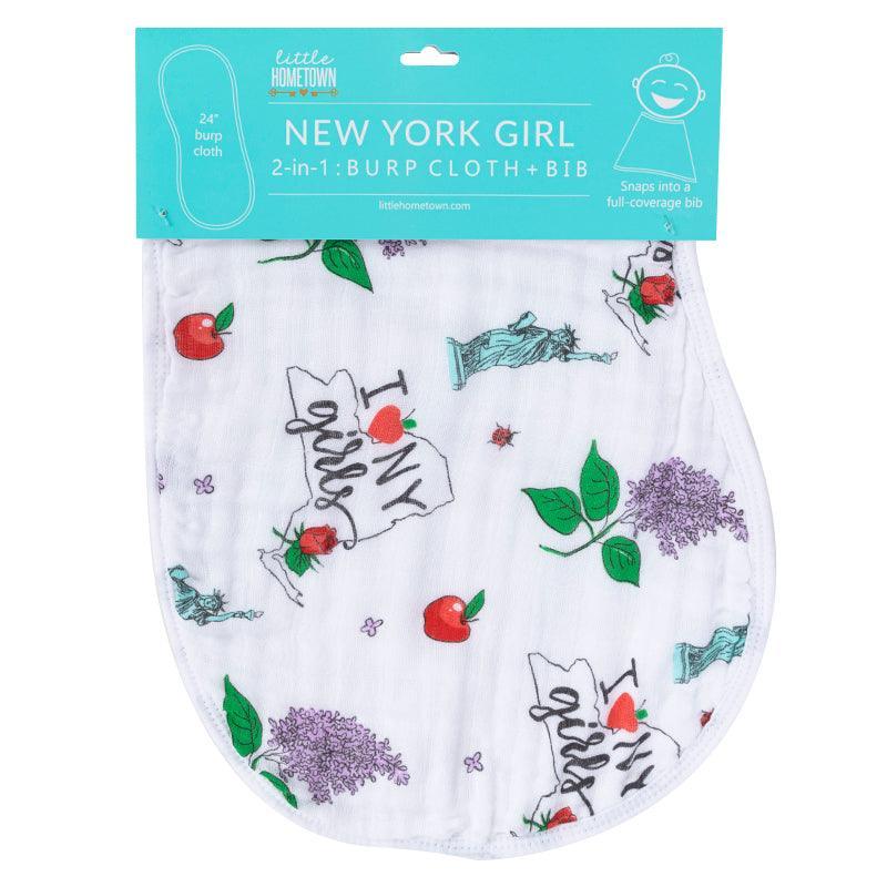 Baby bib and burp cloth set with "New York Girl" text, featuring pink and white stripes and city-themed illustrations.