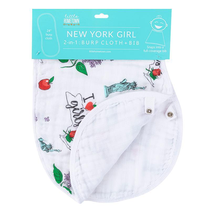 Baby bib and burp cloth set with "New York Girl" text, featuring NYC icons like the Statue of Liberty and yellow cabs.