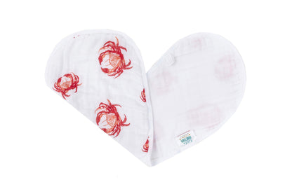 Pink crab-patterned baby bib and burp cloth set on a white background, perfect for newborns and infants.