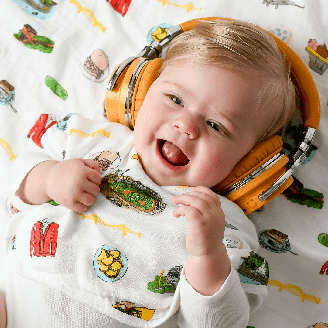 Baby bib and burp cloth set with Pittsburgh skyline and "Little Hometown" text, in soft pastel colors.