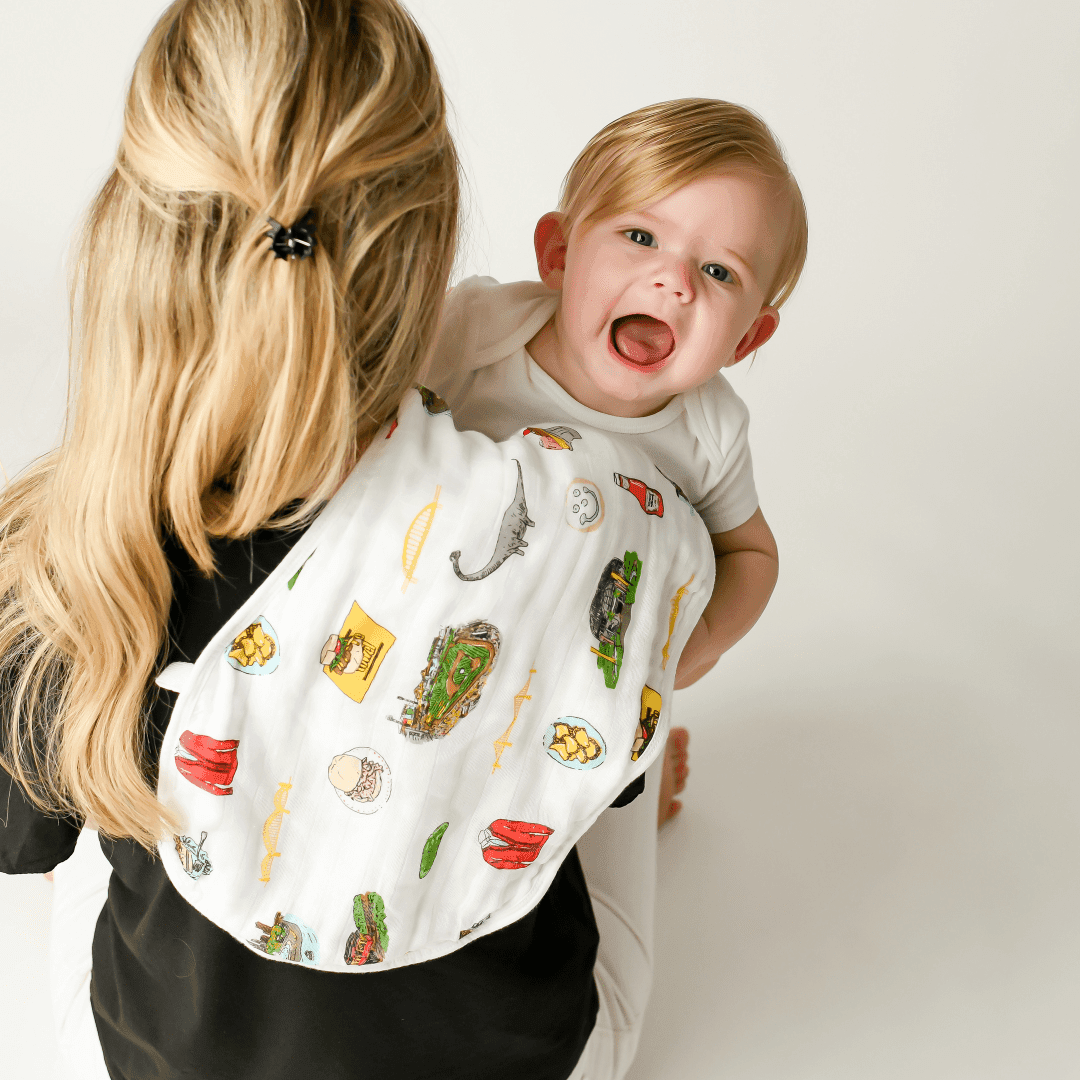 Baby bib and burp cloth set with Pittsburgh skyline design, featuring iconic yellow bridges and cityscape.