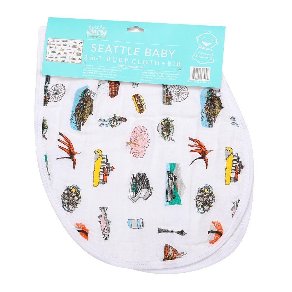 Baby bib and burp cloth set featuring Seattle landmarks in a playful, colorful design on a white background.