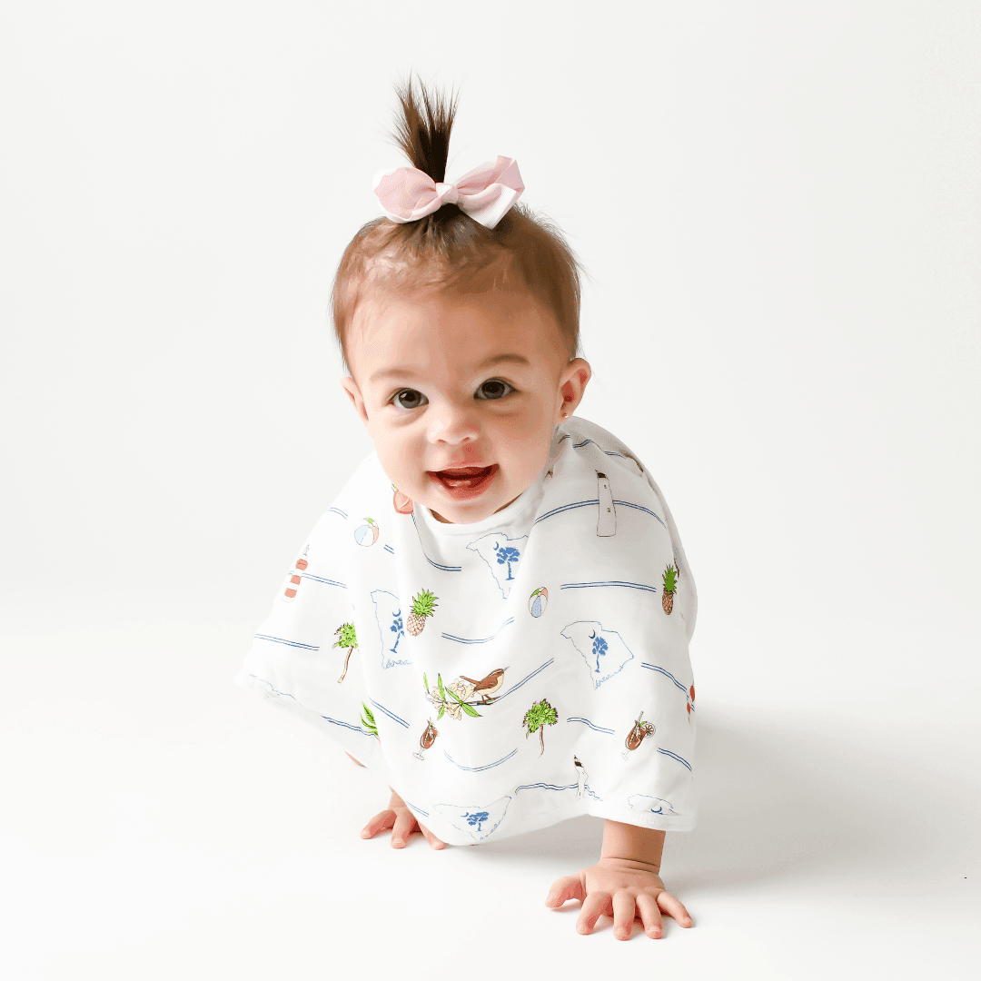 Baby bib and burp cloth set with South Carolina map design, featuring landmarks and playful illustrations.