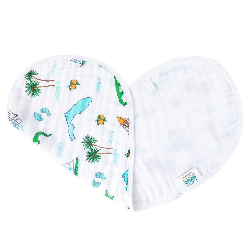 Baby burp cloth and wraparound bib set with Florida-themed illustrations, including oranges and palm trees.