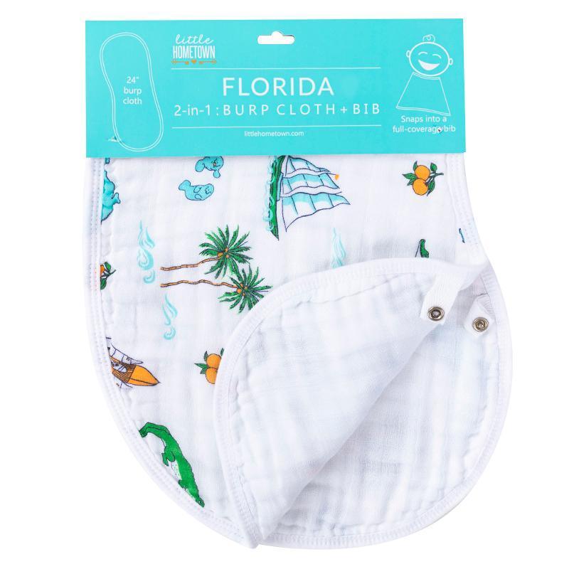 Baby burp cloth and wraparound bib set with Florida-themed illustrations, including oranges and palm trees.