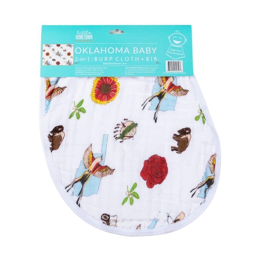 Baby burp cloth and wraparound bib set featuring "Oklahoma Baby" text and state-themed illustrations in soft pastels.