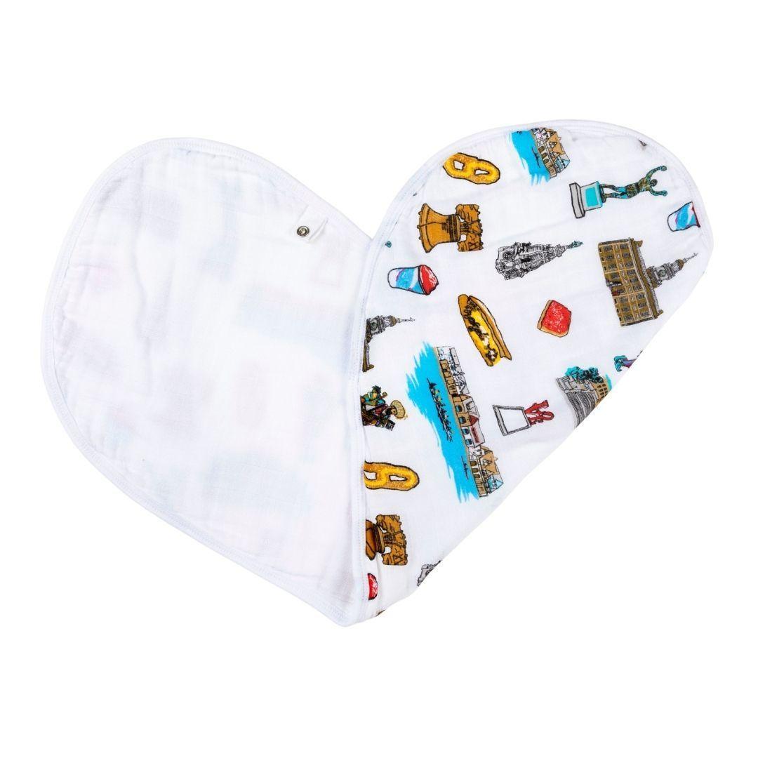 Baby burp cloth and wraparound bib set featuring Philadelphia landmarks in soft pastel colors on white fabric.