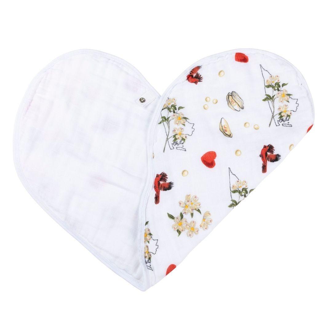 Baby burp cloth and wraparound bib with delicate Virginia floral pattern in soft pastel colors on white fabric.