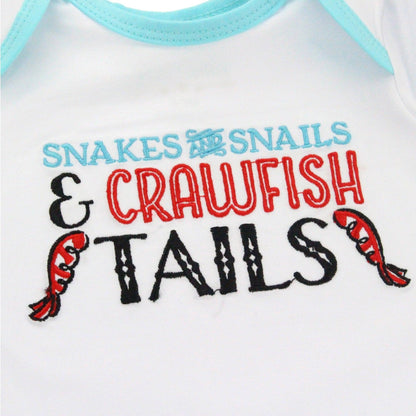 Baby gown for 0-3 months with "Snakes and Snails and Crawfish Tails" print, featuring playful animal illustrations.