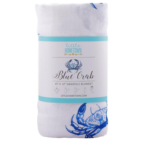 White muslin swaddle blanket with blue crab illustrations, evoking a coastal theme, by Little Hometown.