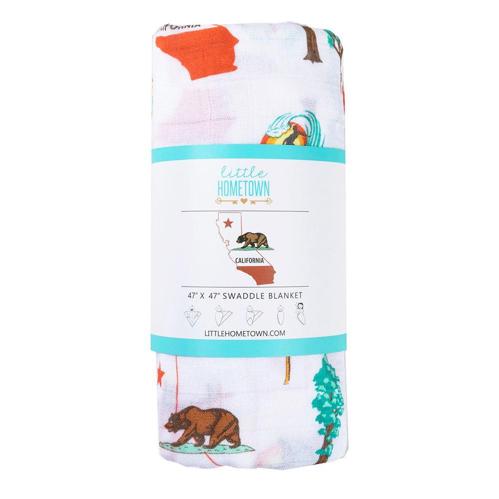 White muslin swaddle blanket with California-themed illustrations, including palm trees, surfboards, and bears.